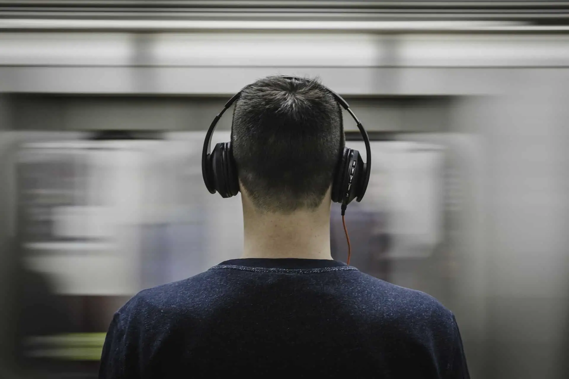 Guy in headphone on subway