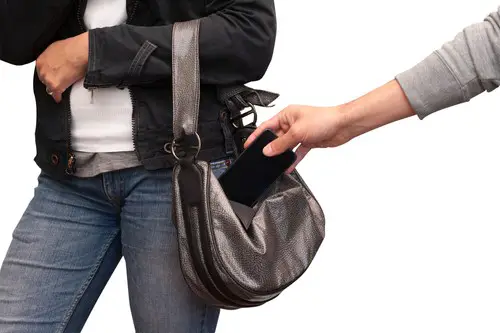 pickpocket stealing an iphone