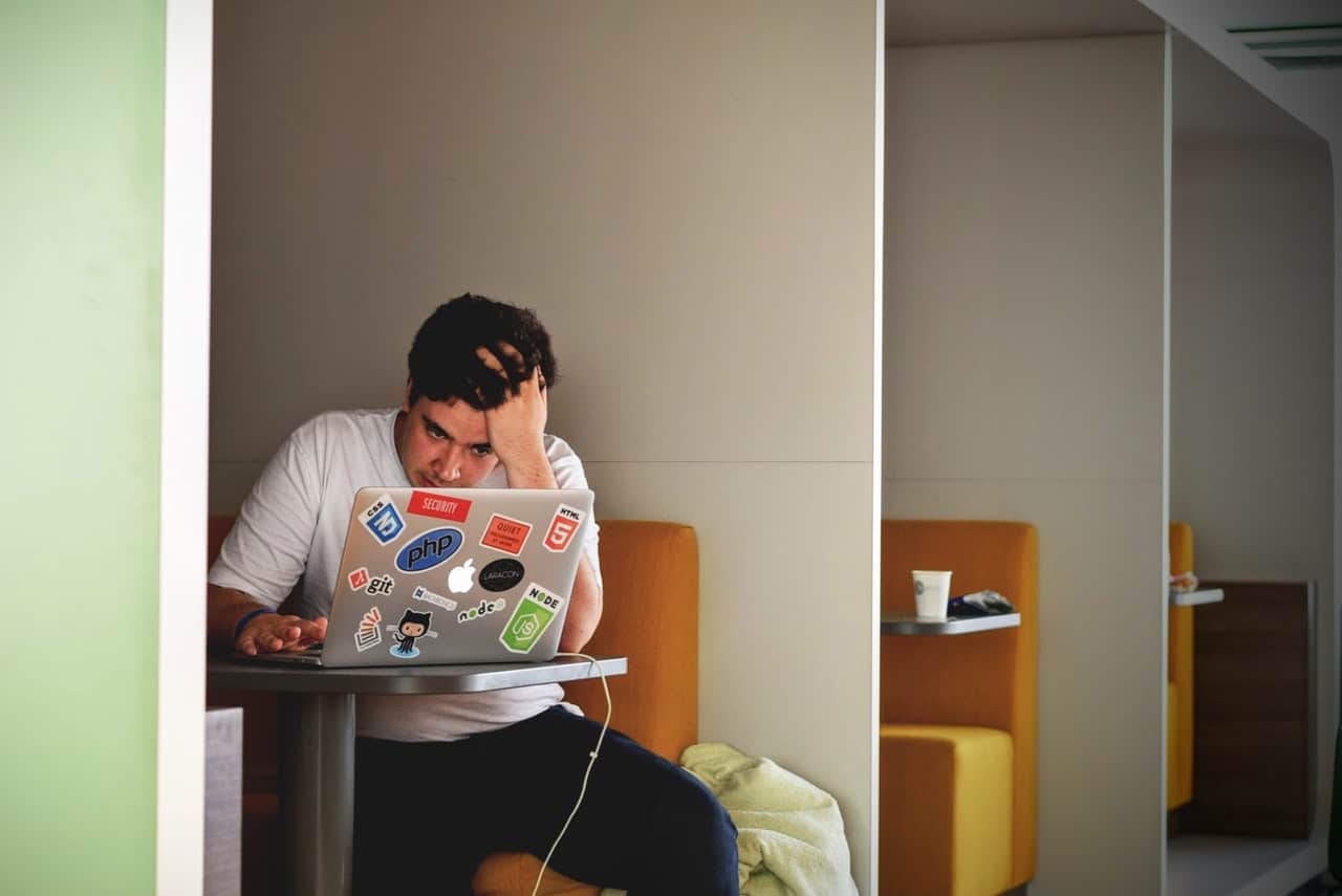 frustrated person using laptop